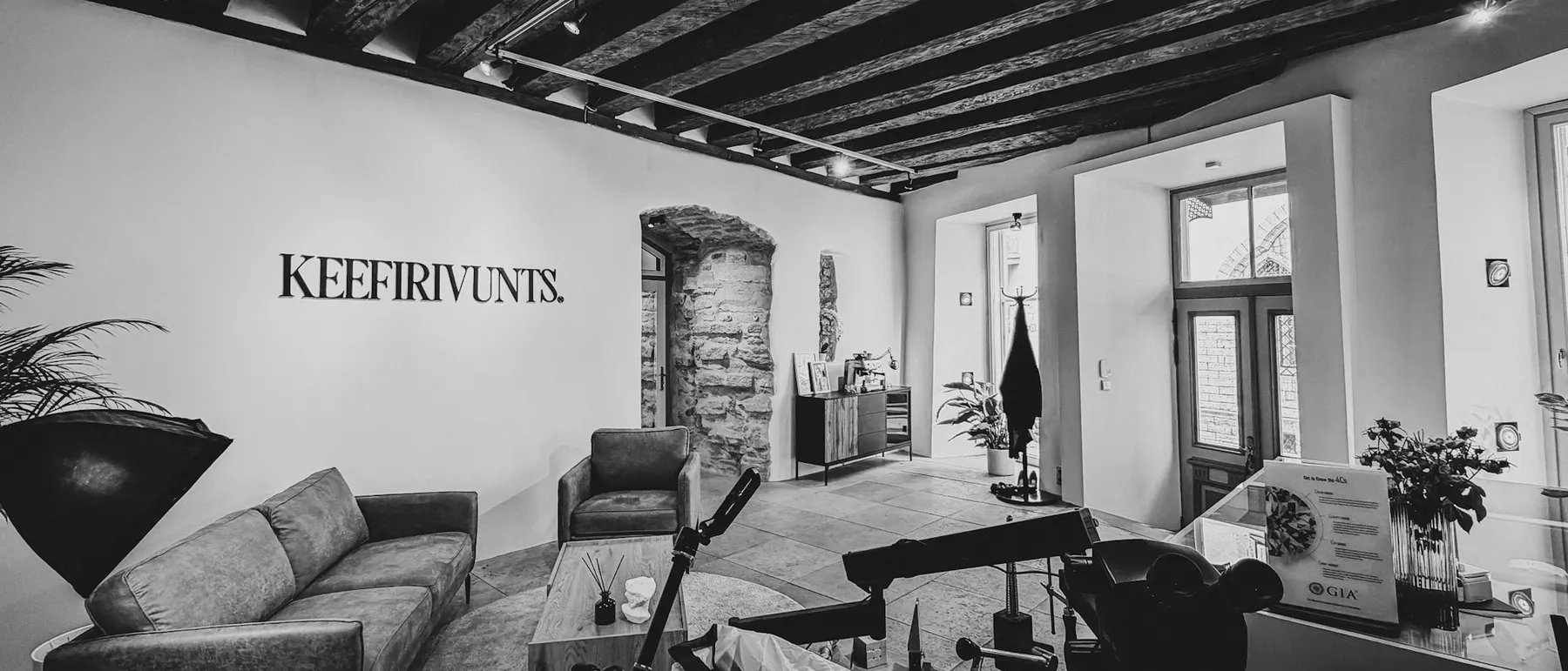 The Keefirivunts atelier at Suur-Karja 2 — the logo wall, the sofa, the workbench