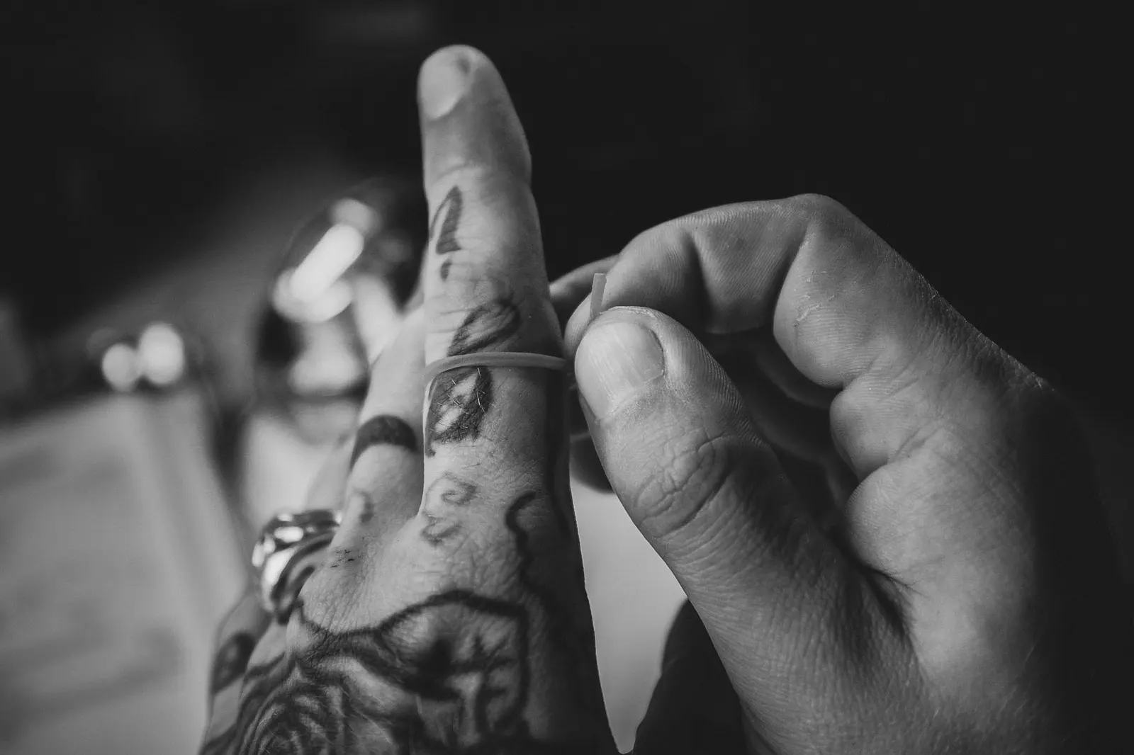 A thread wrapped around a finger for measuring, close-up of hands